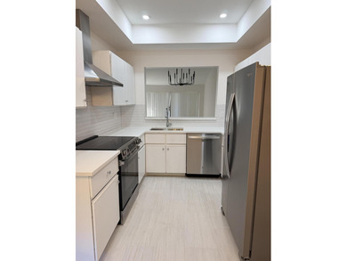 UPDATED 2ND FLOOR CONDO FEATURING WHITE EAT-IN KITCHEN WITH NEW on Boca Delray Golf and Country Club in Florida - for sale on GolfHomes.com, golf home, golf lot
