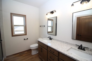 The Emerson is a 3 bed, 2.5 bath home on a lookout basement lot on Twin Lakes Country Club in Wisconsin - for sale on GolfHomes.com, golf home, golf lot