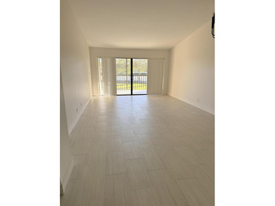 UPDATED 2ND FLOOR CONDO FEATURING WHITE EAT-IN KITCHEN WITH NEW on Boca Delray Golf and Country Club in Florida - for sale on GolfHomes.com, golf home, golf lot