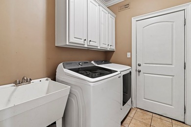 This truly custom residence is rich in architectural detail on The Patriot Golf Club At Grand Harbor in South Carolina - for sale on GolfHomes.com, golf home, golf lot