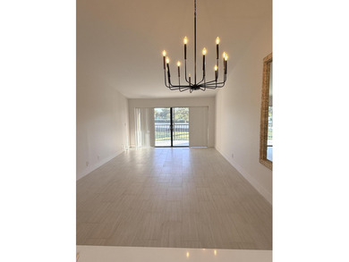 UPDATED 2ND FLOOR CONDO FEATURING WHITE EAT-IN KITCHEN WITH NEW on Boca Delray Golf and Country Club in Florida - for sale on GolfHomes.com, golf home, golf lot