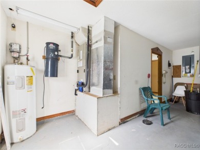 Discover this spacious 3/2.5/2 residence nestled on a cul-de-sac on Sugarmill Woods Golf and Country Club in Florida - for sale on GolfHomes.com, golf home, golf lot
