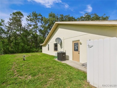 Discover this spacious 3/2.5/2 residence nestled on a cul-de-sac on Sugarmill Woods Golf and Country Club in Florida - for sale on GolfHomes.com, golf home, golf lot