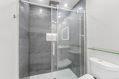 Welcome to your dream home! This totally renovated masterpiece on Delaire Golf and Country Club in Florida - for sale on GolfHomes.com, golf home, golf lot