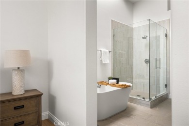 Nestled in a secure gated community within walking distance to on Tustin Ranch Golf Club in California - for sale on GolfHomes.com, golf home, golf lot