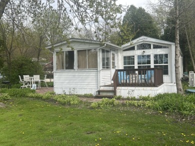 Enjoy the beauty of Pistakee Lake from this charming 1-bedroom on Pistakee Country Club in Illinois - for sale on GolfHomes.com, golf home, golf lot
