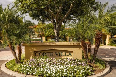 Nestled in a secure gated community within walking distance to on Tustin Ranch Golf Club in California - for sale on GolfHomes.com, golf home, golf lot
