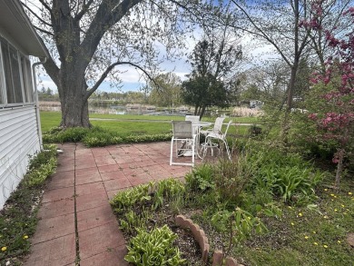 Enjoy the beauty of Pistakee Lake from this charming 1-bedroom on Pistakee Country Club in Illinois - for sale on GolfHomes.com, golf home, golf lot