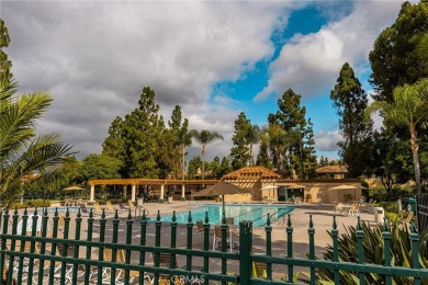Nestled in a secure gated community within walking distance to on Tustin Ranch Golf Club in California - for sale on GolfHomes.com, golf home, golf lot