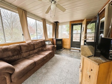 Enjoy the beauty of Pistakee Lake from this charming 1-bedroom on Pistakee Country Club in Illinois - for sale on GolfHomes.com, golf home, golf lot