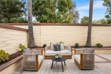 Nestled in a secure gated community within walking distance to on Tustin Ranch Golf Club in California - for sale on GolfHomes.com, golf home, golf lot