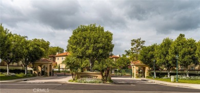 Nestled in a secure gated community within walking distance to on Tustin Ranch Golf Club in California - for sale on GolfHomes.com, golf home, golf lot