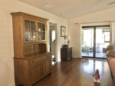 Move right into this concrete block home that backs up to the on Spanish Lakes I in Florida - for sale on GolfHomes.com, golf home, golf lot