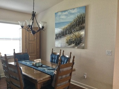 Move right into this concrete block home that backs up to the on Spanish Lakes I in Florida - for sale on GolfHomes.com, golf home, golf lot