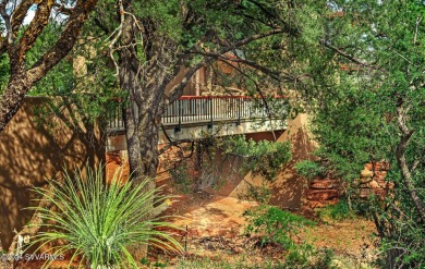 Open your private gated bridge to enter this beautiful oasis on Oakcreek Country Club in Arizona - for sale on GolfHomes.com, golf home, golf lot