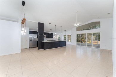 Welcome to the perfect Florida retreat where lush green fairways on Oakwood Golf Club in Florida - for sale on GolfHomes.com, golf home, golf lot