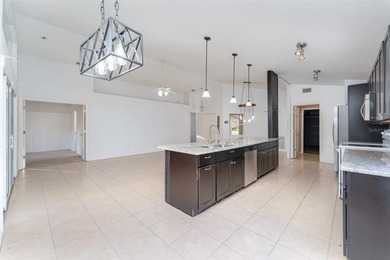 Welcome to the perfect Florida retreat where lush green fairways on Oakwood Golf Club in Florida - for sale on GolfHomes.com, golf home, golf lot