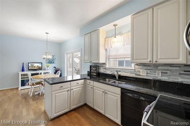 Welcome home to this charming detached colonial-style condo in on The Maples Club in Michigan - for sale on GolfHomes.com, golf home, golf lot