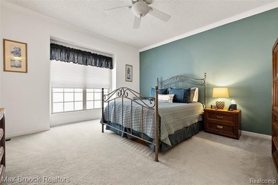 Welcome home to this charming detached colonial-style condo in on The Maples Club in Michigan - for sale on GolfHomes.com, golf home, golf lot