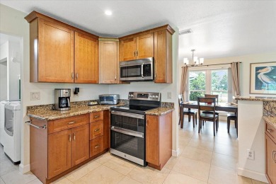 Tucked along a quiet stretch of Sandpiper Bay, this home blends on Club Med Sandpiper in Florida - for sale on GolfHomes.com, golf home, golf lot