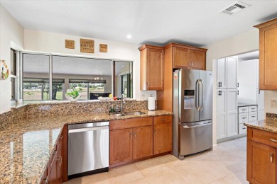 Tucked along a quiet stretch of Sandpiper Bay, this home blends on Club Med Sandpiper in Florida - for sale on GolfHomes.com, golf home, golf lot