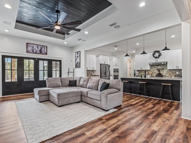 Stunning 5,100 sq ft home with located right across from the on Wildwood Country Club in Florida - for sale on GolfHomes.com, golf home, golf lot