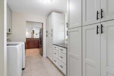 Tucked along a quiet stretch of Sandpiper Bay, this home blends on Club Med Sandpiper in Florida - for sale on GolfHomes.com, golf home, golf lot