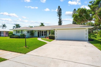 Tucked along a quiet stretch of Sandpiper Bay, this home blends on Club Med Sandpiper in Florida - for sale on GolfHomes.com, golf home, golf lot