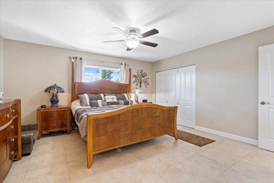 Tucked along a quiet stretch of Sandpiper Bay, this home blends on Club Med Sandpiper in Florida - for sale on GolfHomes.com, golf home, golf lot