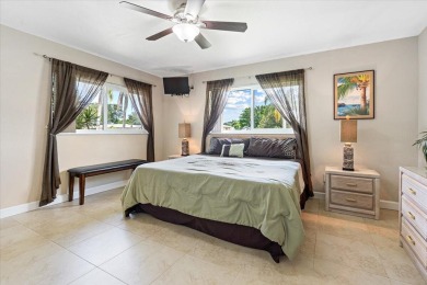 Tucked along a quiet stretch of Sandpiper Bay, this home blends on Club Med Sandpiper in Florida - for sale on GolfHomes.com, golf home, golf lot
