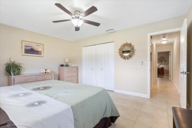 Tucked along a quiet stretch of Sandpiper Bay, this home blends on Club Med Sandpiper in Florida - for sale on GolfHomes.com, golf home, golf lot