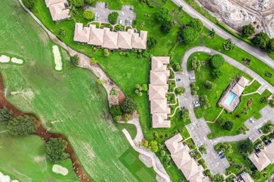 Picturesque double fairway views from this stunning 2nd floor, 3 on Quail Ridge Golf Course and Country Club in Florida - for sale on GolfHomes.com, golf home, golf lot