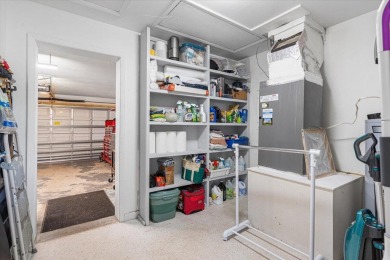 Tucked along a quiet stretch of Sandpiper Bay, this home blends on Club Med Sandpiper in Florida - for sale on GolfHomes.com, golf home, golf lot