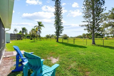 Tucked along a quiet stretch of Sandpiper Bay, this home blends on Club Med Sandpiper in Florida - for sale on GolfHomes.com, golf home, golf lot
