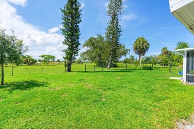 Tucked along a quiet stretch of Sandpiper Bay, this home blends on Club Med Sandpiper in Florida - for sale on GolfHomes.com, golf home, golf lot