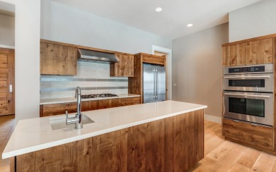 Stunning single level end-unit townhome perched on a natural on Tetherow Golf Club in Oregon - for sale on GolfHomes.com, golf home, golf lot