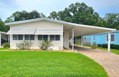 This home is located on leased land in a 55+ resort-style MH on Big Cypress Golf and Country Club in Florida - for sale on GolfHomes.com, golf home, golf lot