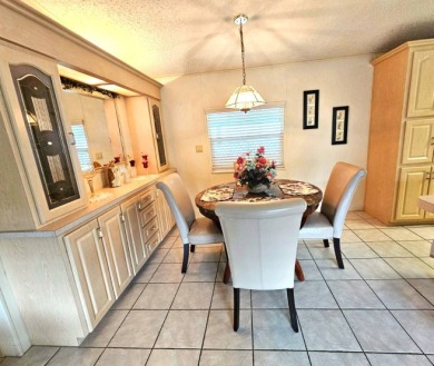 This home is located on leased land in a 55+ resort-style MH on Big Cypress Golf and Country Club in Florida - for sale on GolfHomes.com, golf home, golf lot