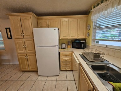 This home is located on leased land in a 55+ resort-style MH on Big Cypress Golf and Country Club in Florida - for sale on GolfHomes.com, golf home, golf lot