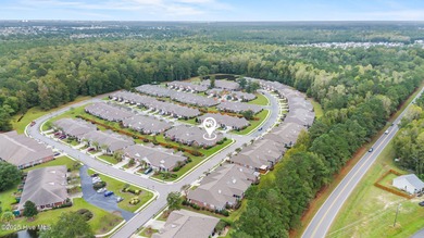This lovely brick townhome is tucked away in one of Leland's on Magnolia Greens Golf Plantation in North Carolina - for sale on GolfHomes.com, golf home, golf lot