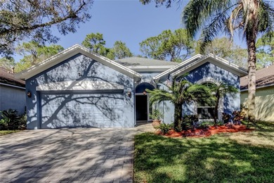 This fantastic Westchase home is located on a private wooded on Westchase Golf Club in Florida - for sale on GolfHomes.com, golf home, golf lot