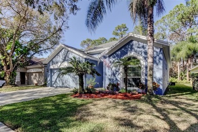 This fantastic Westchase home is located on a private wooded on Westchase Golf Club in Florida - for sale on GolfHomes.com, golf home, golf lot