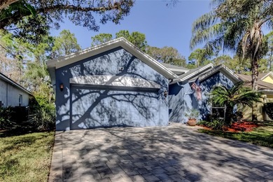 This fantastic Westchase home is located on a private wooded on Westchase Golf Club in Florida - for sale on GolfHomes.com, golf home, golf lot