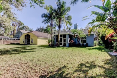 This fantastic Westchase home is located on a private wooded on Westchase Golf Club in Florida - for sale on GolfHomes.com, golf home, golf lot