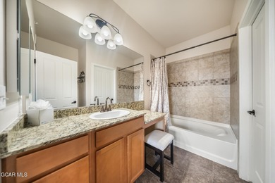 Wake up to panoramic mountain views, spend your days skiing or on Headwaters Golf Course At Granby Ranch in Colorado - for sale on GolfHomes.com, golf home, golf lot