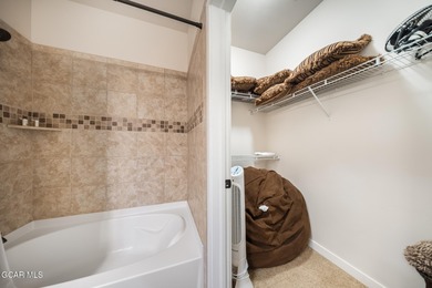 Wake up to panoramic mountain views, spend your days skiing or on Headwaters Golf Course At Granby Ranch in Colorado - for sale on GolfHomes.com, golf home, golf lot