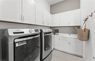 Fall in love with the stunning Layton Grande home in Terreno by on Valencia Golf and Country Club in Florida - for sale on GolfHomes.com, golf home, golf lot
