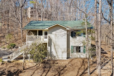 Tucked away in the sought-after Rumbling Bald community, this on Rumbling Bald Resort on Lake Lure in North Carolina - for sale on GolfHomes.com, golf home, golf lot