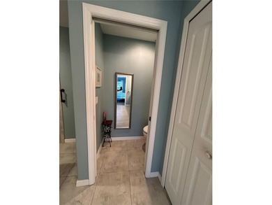 Welcome to this immaculate move in ready home on a double lot on Rotonda Golf and Country Club The Palms Course in Florida - for sale on GolfHomes.com, golf home, golf lot