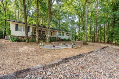 Nestled on a quiet street and surrounded by mature trees, this on DeSoto Golf Course in Arkansas - for sale on GolfHomes.com, golf home, golf lot